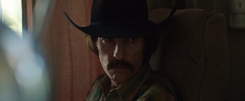 Movie still from “Dallas Buyers Club” (2013), directed by Jean-Marc Vallée – A person wearing a cowboy hat; Close Up shot, Over the shoulder angle