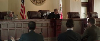 Movie still from “Dallas Buyers Club” (2013), directed by Jean-Marc Vallée – A judge in front of two men in suits; Wide shot, Over the shoulder angle