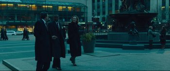 Movie still from “Dark Waters” (2019), directed by Todd Haynes – A man and a woman walking down a street; Wide shot, Over the shoulder angle