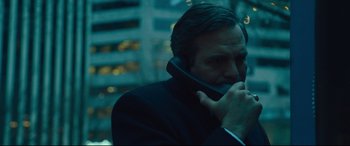 Movie still from “Dark Waters” (2019), directed by Todd Haynes – A man talking on a phone while wearing a suit and tie; Close Up shot, Low angle