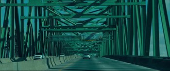 Movie still from “Dark Waters” (2019), directed by Todd Haynes – A car is driving on a bridge over a river; Extreme Wide shot, High angle