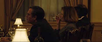 Movie still from “Dark Waters” (2019), directed by Todd Haynes – A man and a woman sitting at a table drinking wine; Medium shot, Over the shoulder angle