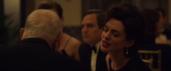 Movie still from “Dark Waters” (2019), directed by Todd Haynes – A group of people standing next to each other in a room; Close Up shot, Over the shoulder angle