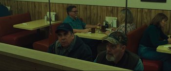 Movie still from “Dark Waters” (2019), directed by Todd Haynes – A group of men sitting at a table in a restaurant; Medium shot, Over the shoulder angle