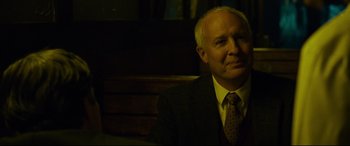Movie still from “Dark Waters” (2019), directed by Todd Haynes – An older man wearing a suit and tie; Close Up shot, Over the shoulder angle