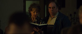 Movie still from “Dark Waters” (2019), directed by Todd Haynes – A man and a woman looking at a book; Medium shot, Over the shoulder angle