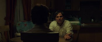 Movie still from “Dark Waters” (2019), directed by Todd Haynes – Two people sitting at a table talking to each other; Medium shot, Over the shoulder angle
