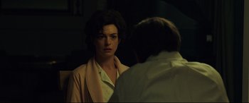 Movie still from “Dark Waters” (2019), directed by Todd Haynes – A woman looking at a man in the mirror; Medium shot, Over the shoulder angle