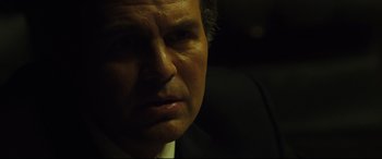 Movie still from “Dark Waters” (2019), directed by Todd Haynes – A person wearing a suit and tie; Close Up shot, Low angle