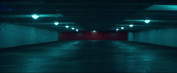 Movie still from “Dark Waters” (2019), directed by Todd Haynes – An empty parking lot with lights shining on it; Extreme Wide shot, High angle