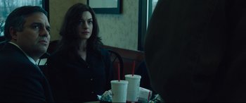 Movie still from “Dark Waters” (2019), directed by Todd Haynes – A woman sitting at a table with two drinks in front of her; Close Up shot, Over the shoulder angle