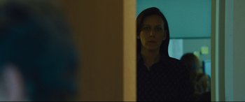 Movie still from “Dark Waters” (2019), directed by Todd Haynes – A woman standing in front of a mirror looking at the camera; Close Up shot, Over the shoulder angle