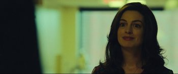 Movie still from “Dark Waters” (2019), directed by Todd Haynes – A woman with long dark brown hair standing in front of a window; Close Up shot, Over the shoulder angle