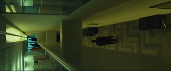 Movie still from “Dark Waters” (2019), directed by Todd Haynes – A man laying on the ground in a room; Extreme Wide shot, Overhead angle