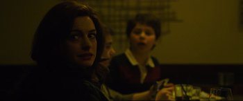 Movie still from “Dark Waters” (2019), directed by Todd Haynes – A woman and two young boys sitting next to each other; Close Up shot, Over the shoulder angle