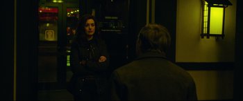 Movie still from “Dark Waters” (2019), directed by Todd Haynes – A woman standing next to a man in front of an elevator; Medium shot, Over the shoulder angle
