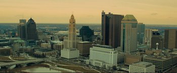 Movie still from “Dark Waters” (2019), directed by Todd Haynes – An aerial view of a large city with tall skyscrapers; Extreme Wide shot, High angle