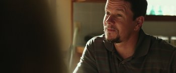 Movie still from “Deepwater Horizon” (2016), directed by Peter Berg – A person sitting in a room; Close Up shot, Over the shoulder angle