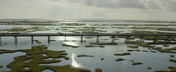 Movie still from “Deepwater Horizon” (2016), directed by Peter Berg – An image of a bridge over a body of water; Extreme Wide shot, High angle