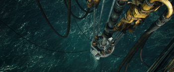 Movie still from “Deepwater Horizon” (2016), directed by Peter Berg – An aerial view of an oil rig in the middle of the ocean; Extreme Wide shot, Overhead angle