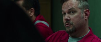 Movie still from “Deepwater Horizon” (2016), directed by Peter Berg – A person wearing a red jacket; Close Up shot, Over the shoulder angle