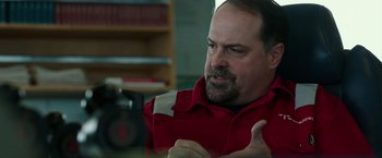 Movie still from “Deepwater Horizon” (2016), directed by Peter Berg – A person wearing a red shirt; Close Up shot, Over the shoulder angle