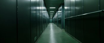 Movie still from “Deepwater Horizon” (2016), directed by Peter Berg – A long hallway lined with lots of metal cabinets; Extreme Wide shot, High angle