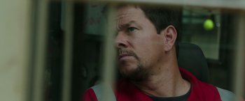 Movie still from “Deepwater Horizon” (2016), directed by Peter Berg – A person looking out of a window; Close Up shot, Low angle