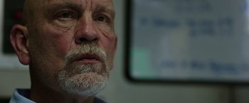 Movie still from “Deepwater Horizon” (2016), directed by Peter Berg – An older man with a beard and mustache; Close Up shot, Low angle