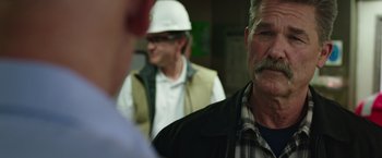 Movie still from “Deepwater Horizon” (2016), directed by Peter Berg – A group of men standing next to each other in a room; Close Up shot, Over the shoulder angle