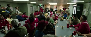 Movie still from “Deepwater Horizon” (2016), directed by Peter Berg – A group of people sitting around a table; Wide shot, High angle