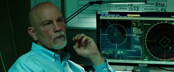 Movie still from “Deepwater Horizon” (2016), directed by Peter Berg – An older man sitting in front of a computer screen; Close Up shot, Over the shoulder angle