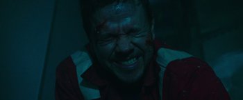 Movie still from “Deepwater Horizon” (2016), directed by Peter Berg – A man with blood all over his face and head; Close Up shot, Low angle