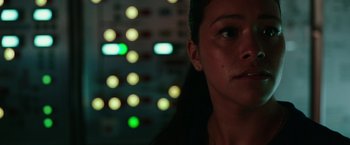 Movie still from “Deepwater Horizon” (2016), directed by Peter Berg – A woman's face in front of lights; Close Up shot, Low angle