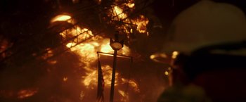 Movie still from “Deepwater Horizon” (2016), directed by Peter Berg – A street light in the middle of a burning building; Extreme Wide shot, Low angle