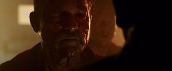 Movie still from “Deepwater Horizon” (2016), directed by Peter Berg – A person's face with blood on his face; Extreme Close Up shot, Over the shoulder angle