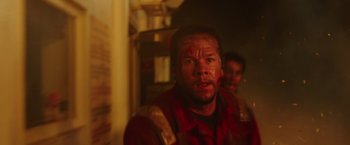 Movie still from “Deepwater Horizon” (2016), directed by Peter Berg – A person with a face paint on; Close Up shot, Low angle