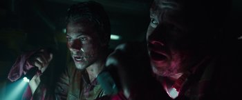 Movie still from “Deepwater Horizon” (2016), directed by Peter Berg – Two men in the dark looking at the camera; Close Up shot, Low angle