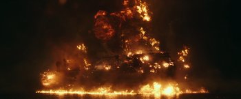 Movie still from “Deepwater Horizon” (2016), directed by Peter Berg – A large fire is burning in the night sky; Extreme Wide shot, Low angle