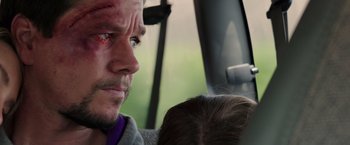 Movie still from “Deepwater Horizon” (2016), directed by Peter Berg – A person with a bruise on his face; Close Up shot, Over the shoulder angle