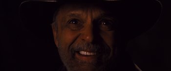 Movie still from “Django Unchained” (2012), directed by Quentin Tarantino – An older man smiling for the camera; Close Up shot, Overhead angle