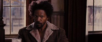 Movie still from “Django Unchained” (2012), directed by Quentin Tarantino – A person wearing a jacket; Close Up shot, Over the shoulder angle