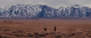 Movie still from “Django Unchained” (2012), directed by Quentin Tarantino – Two people riding horses in the middle of the desert; Extreme Wide shot, Low angle