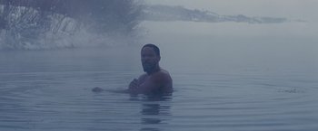 Movie still from “Django Unchained” (2012), directed by Quentin Tarantino – A man in a body of water in the fog; Medium shot, High angle
