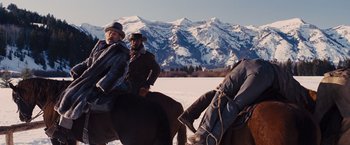 Movie still from “Django Unchained” (2012), directed by Quentin Tarantino – Two men on horses in the snow with mountains in the background; Wide shot, Low angle