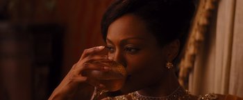 Movie still from “Django Unchained” (2012), directed by Quentin Tarantino – A person drinking a glass of wine; Close Up shot, High angle