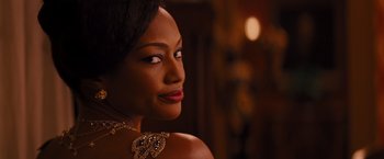 Movie still from “Django Unchained” (2012), directed by Quentin Tarantino – A beautiful woman with red lipstick looking to her left; Close Up shot, Over the shoulder angle