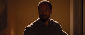 Movie still from “Django Unchained” (2012), directed by Quentin Tarantino – A person wearing a shirt; Close Up shot, Over the shoulder angle