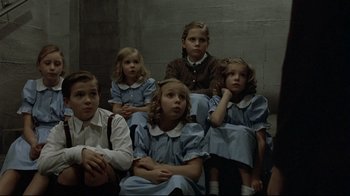 Movie still from “Downfall” (2004), directed by Oliver Hirschbiegel – A group of children sitting next to each other; Medium shot, High angle