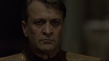 Movie still from “Downfall” (2004), directed by Oliver Hirschbiegel – A person wearing a military uniform; Close Up shot, Over the shoulder angle